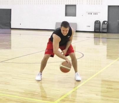 stance, tap-dribble the ball around one leg then the other to form a