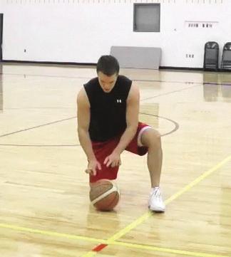 the ground, tap-dribble the ball from hand to hand using only one finger