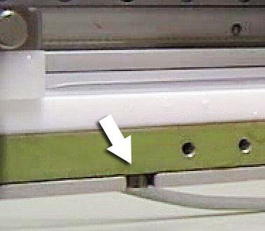Image 3.4: Replacing the trough so that the screws slot into the respective notches. Clean the barriers. The appropriate cleaning method is the same as with the trough.