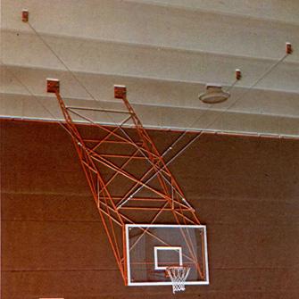 CEILING SUSPENDED BASKETBALL SYSTEM Ceiling suspended basketball system. Painted steel structure. Dimensions made to measure. Movable up by means of manual winch, steel cables and pulley.