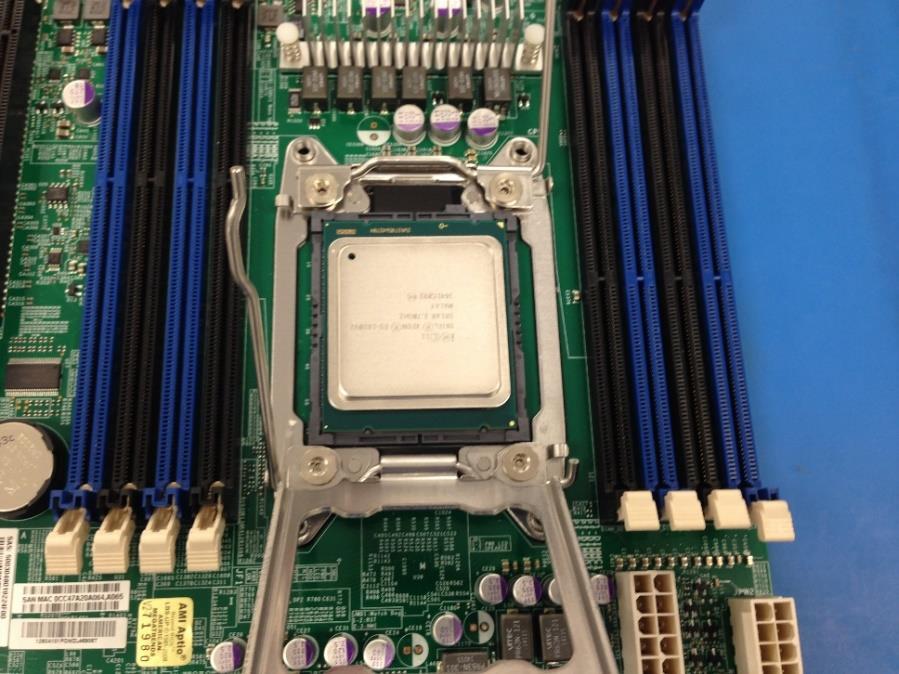 remove & discard CPU cover from Motherboard. Warning: Do Not touch surface of CPU chip area.