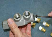 Step 5: Tighten the manifold plug (38) with a