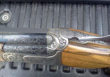 Custom stock, custom engraving with gold inlays and #3 floral checkering on wood.