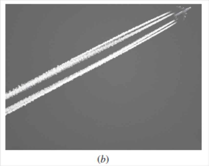 Four contrails initially formed by condensation of water vapor in the low