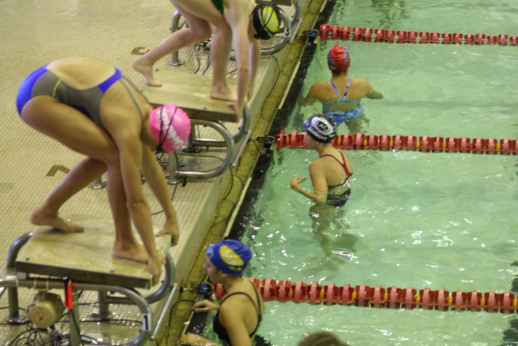 Swimmers should have goggles and IS swim cap. At the blocks, swimmers should introduce themselves to their Timer person and verify their heat and lane assignment.