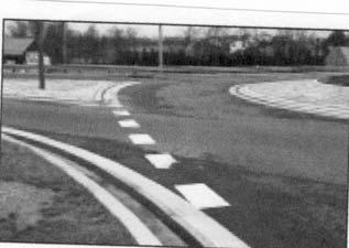 The recommended yield line pavement marking is a broken line treatment consisting of 16 inch wide stripes with 3 ft segments and 3 ft gaps.
