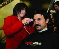 Professional hairstylists from SportClips volunteered to create a championship haircut experience with each participant donating at least 10 inches of hair to support the cause.
