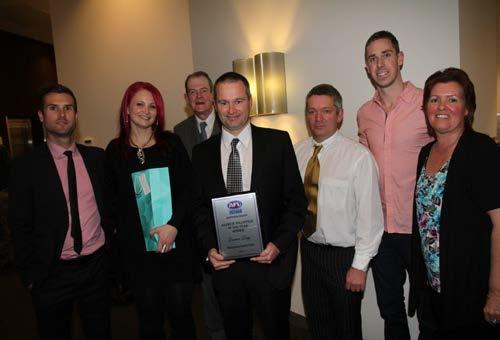 Mertzanidis, Linda Palmer and Roger Fyfe with Auskick Volunteer of the Year Darren Rigg and Nick Maxwell CONTRIBUTION TO