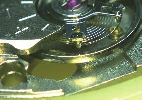 5) engage the balance-spring with the slit of the RegULAtOR PiN.