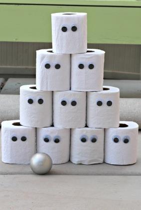 Title: Ghoul Toss Items needed Example How to play: Each player will get a chance to knock down the pyramid of toilet paper ghosts using a soft ball.