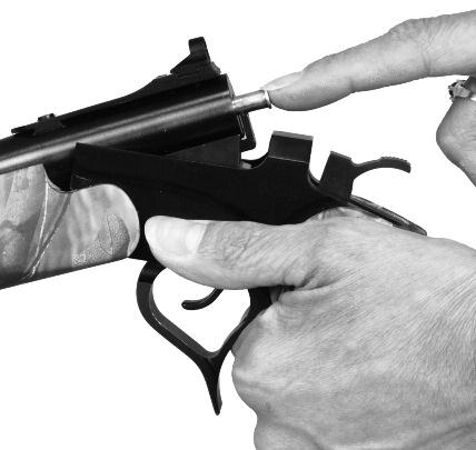 LOADING THE HOT SHOT WARNING: ALWAYS KEEP THE MUZZLE POINTED IN A SAFE DIRECTION. To load the Hot Shot, open the action by pulling up and back on the spur of the trigger guard (FIGURE 10).