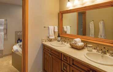 Lower level guest master suite Double vanity, stone countertops and great storage Downstairs, guests will be delighted to stay in the guest master suite.