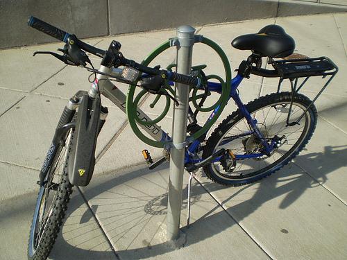 facilities. Each new post-and-ring bicycle parking rack should be installed so that the rings are parallel to the curb and spaced twenty-feet (20 ) a part from one another.