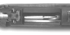 Caution: The cartridge may possibly slide forward into the chamber if the bolt is pushed to far forward. Normally, the cartridge will slide back with the bolt if the bolt is pulled rearward.