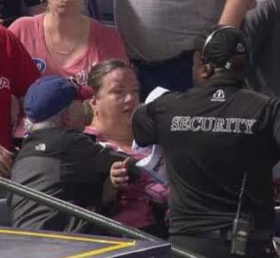 forehead by a foul ball and immediately suffered a large sized bump on her forehead.