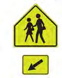 A school sign combined with an AHEAD plaque (W16-9p) creates a School Advance Crossing Assembly, used to warn road users that