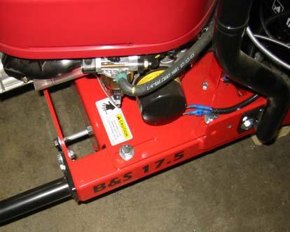 To remove the blade(s) from the mower, lift one side of the mower up in the air and block it securely.