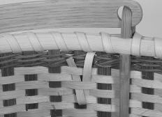 Repeat the looping process working your way around the basket. If the reed becomes dry, simply soak it again before continuing. Remove the clothespins (or ties) as you progress.