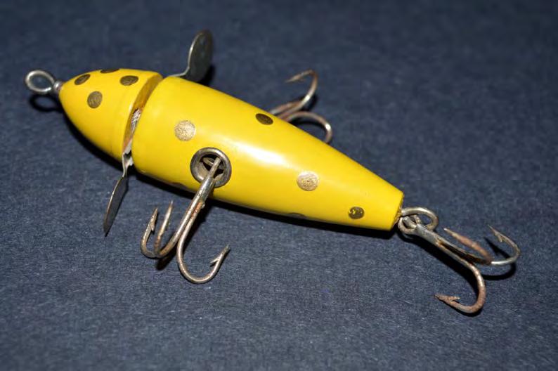 The holes in the twisted lure body allow attachment of three double removable hooks.