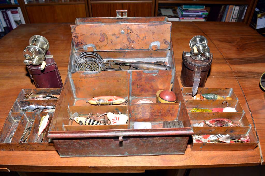 The c1889-1914 Tackle Box This copper tackle box is 11 ½ inches wide, 6 inches high and 8 inches deep and weighs 10 pounds loaded. Its two levels are subdivided and contain stacked trays.