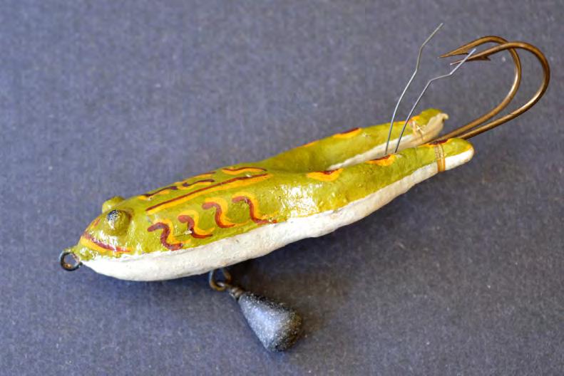 Pflueger Meadow Frog The sinking version of this c1900 lure employs a hand-painted pressed cork body with an external belly weight and 2 upward weedless