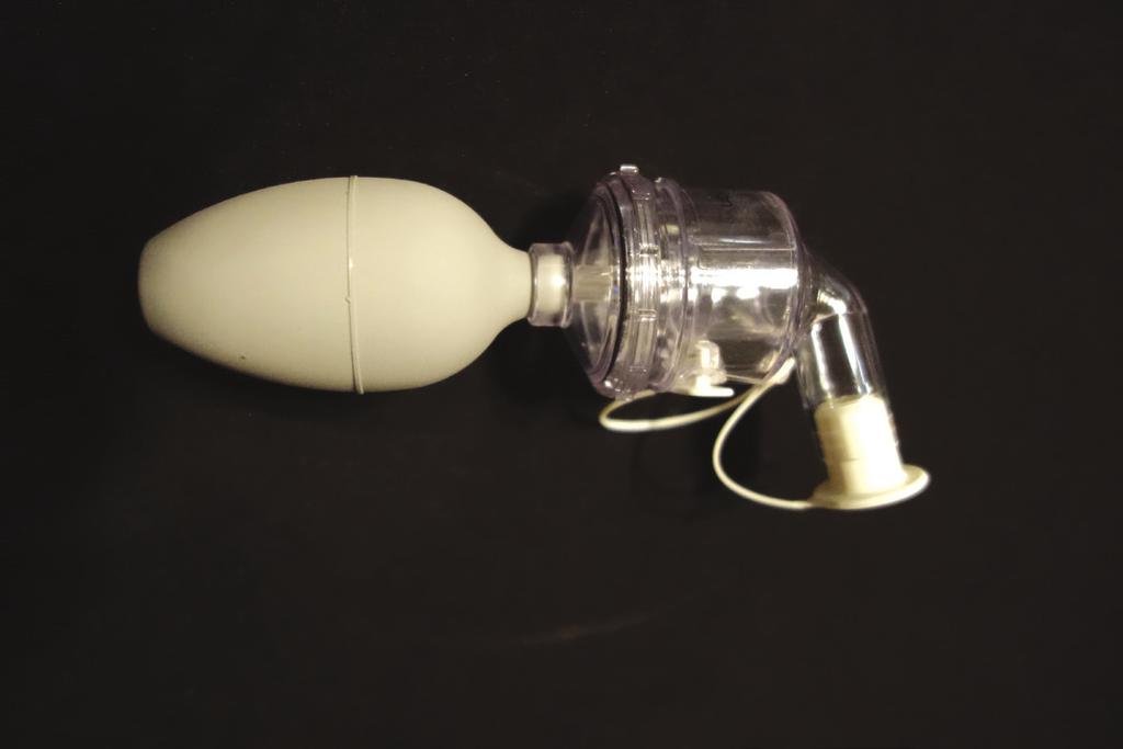 Figure 2. A nebulizer converts solution from liquid to a mist as it is sprayed into a hood. UNL photo. Figure 3.
