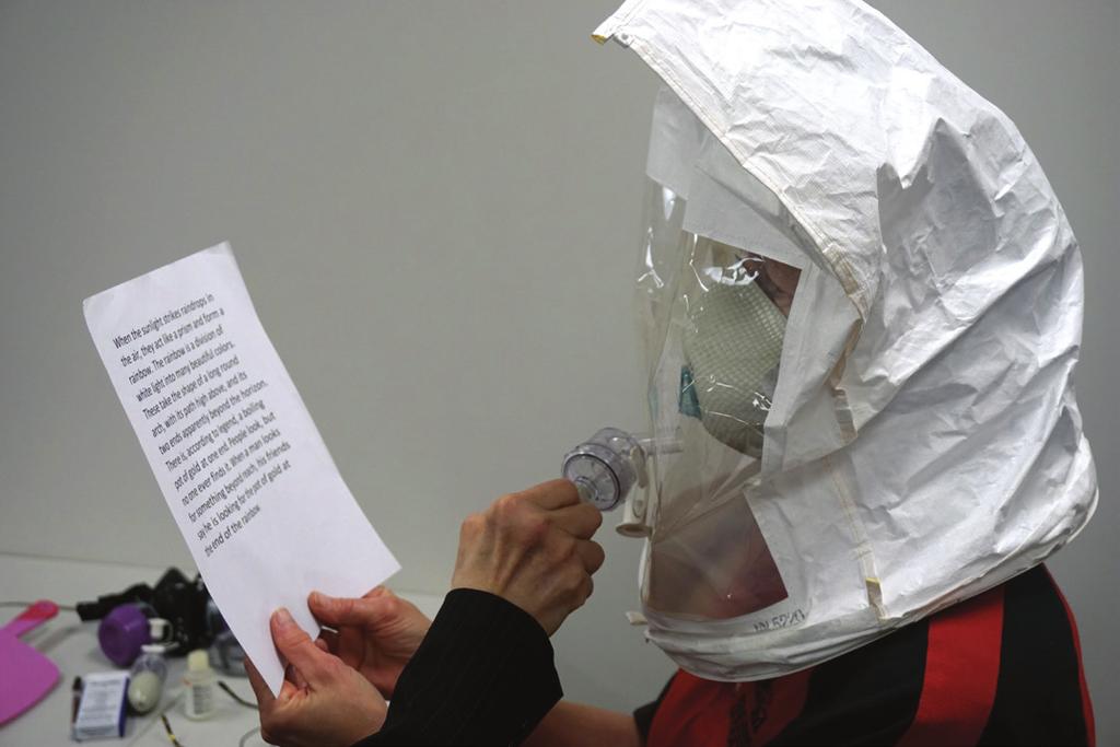 In a work setting, the applicator may have to speak to someone while making an application, so it is important that the respirator has a tight seal when the applicator s mouth is moving. UNL photo.