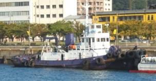 after leaving a dredging area west of Mutsure Shima Island, was engaged in pushing a barge (Vessel C) eastward through the Kanmon Passage to a mud-and-sand dumping ground off Kanda Port, Fukuoka