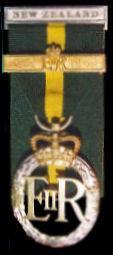 The medal is worn from the left breast suspended from a ribbon, 32-mm in width, of crimson edged white. Officers may receive this medal as long as they have 12 years in the ranks.