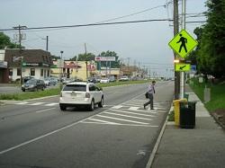 downward-pointing arrow sign Signs and beacons faced both directions High-visibility crosswalk