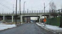 A3: Eighth Steet Viaduct Undepass The sidewalk width is constained unde the Eighth Steet Viaduct by a floodgate and utility pole on the south side.