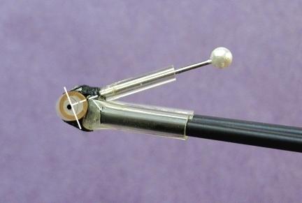 Next take a fat pin or needle and insert it into the root bow nose fitting.