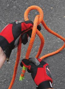 Hold the loop with the left thumb on top. (Step 1) 2. Take the free end of the rope and pass it through the loop.
