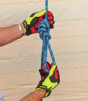 2 With the right hand, push the lower portion of the rope upward to create a loop to the right that crosses in