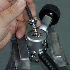 4.2.2 Clamp the regulator carefully in a soft-jawed vise with the HP balance plug (35) facing up.