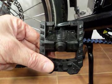 Fold both pedals by pushing inward to release the locking mechanism, then