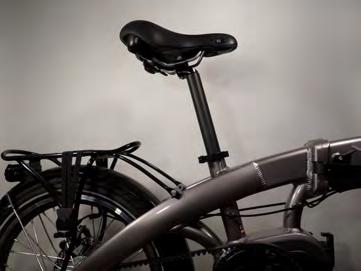 Grasp the quick release lever on the seat clamp, pull away from the bike to