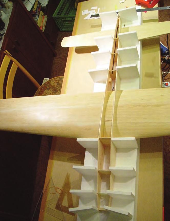 Once the wing has been skinned and sanded, it is then internally cored out in three sections and has hollowed balsa block tips installed.