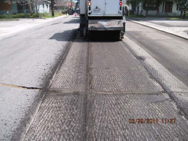 Grind and overlay 1 to 2 of roadway are milled to remove the upper portion of the road surface.