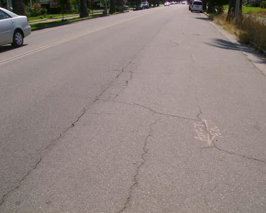 Road surface is relatively even, although weathered with block