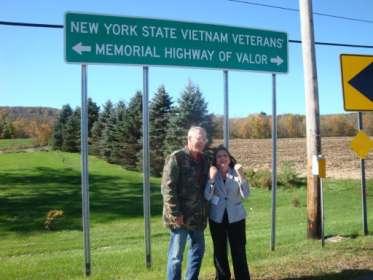 P a g e 3 Bob and Karen Messersmith at the new sign installed on New York State Route 38 known as the Viet Nam Veterans Memorial