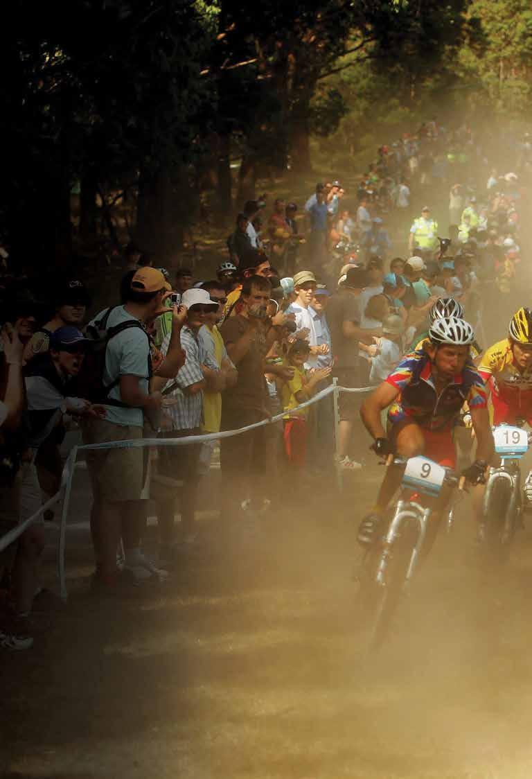 DETERMINATION RARELY SEEN Riders hurtle downhill, power uphill, navigate treacherous terrain, all in the pursuit of gold.