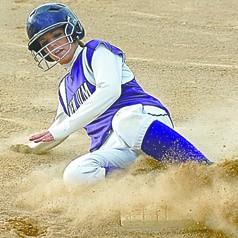 this hit surprised even her at first. New Ulm s Kristen Forstner slides safely into third during the Ealges win against Marshall Monday at Harman Park in New Ulm.
