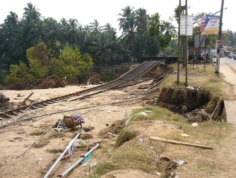 However, the foundations of the railway line inland behind the village were severely scoured by the tsunami that propagated into the river, as shown in Photo 10.