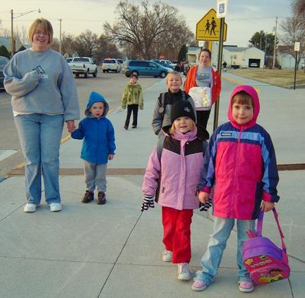 A coalition of parents, neighbors, teachers and administrators designed a Walking School Bus program and advocated for new road signs and increased pedestrian crossing times.
