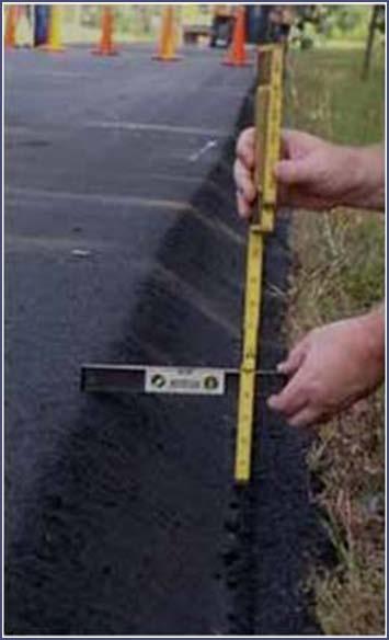 Paving technique where the interface between the roadway and graded shoulder is paved at an angle to eliminate vertical dropoff.