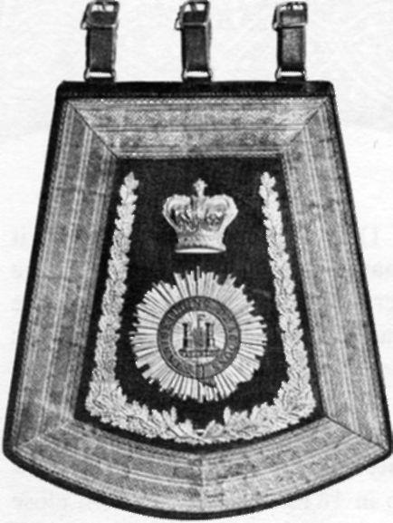 1830, of black leather without any facing cloth, gold lace border and gilt metal insignia and wreath. Note the battle honour "Waterloo" under the castle, and the rounded bottom.