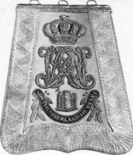 The upper part of the lance penants are embroidered in silver, as are the backgrounds of the two battle honour scrolls.