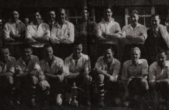 Bentham United with the N.W. Combination League Championship Cup F. Wheildon, J. Lockin, W. Mashiter, J. Bowery, D. Bond, J. Davies, E. Bolton, E. Maunders (trainer) T. Chappell, J. Mewton, R.