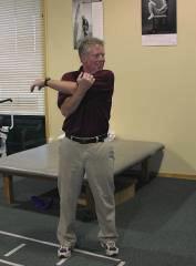 Make sure that your elbow remains straight and rotate your left arm across your body as you would in a backswing,